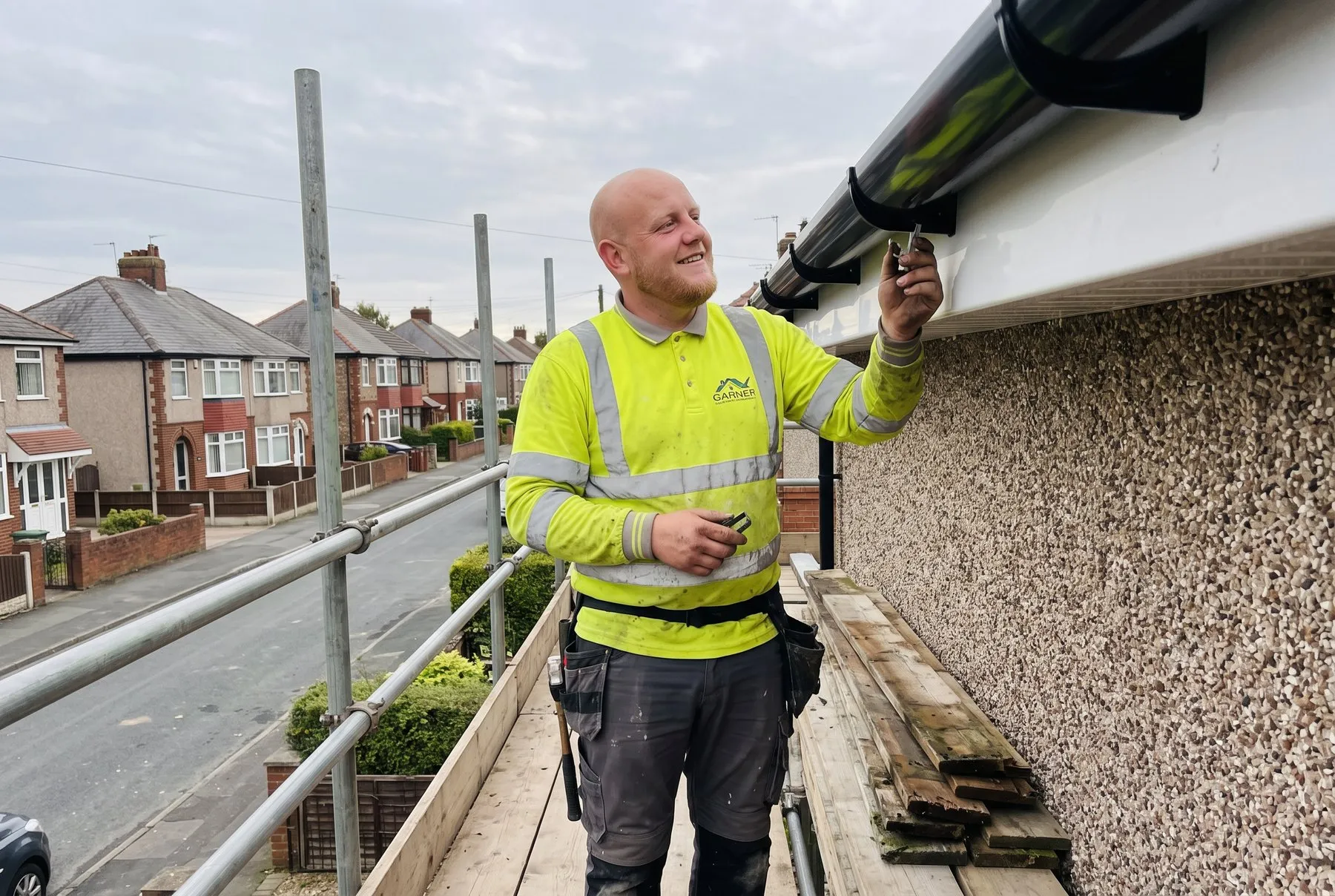 Jamie fitting a new fascia board and gutter